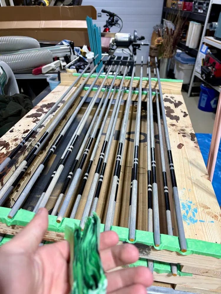 A batch of Twin Arrows Golf alignment sticks drying in the workshop.